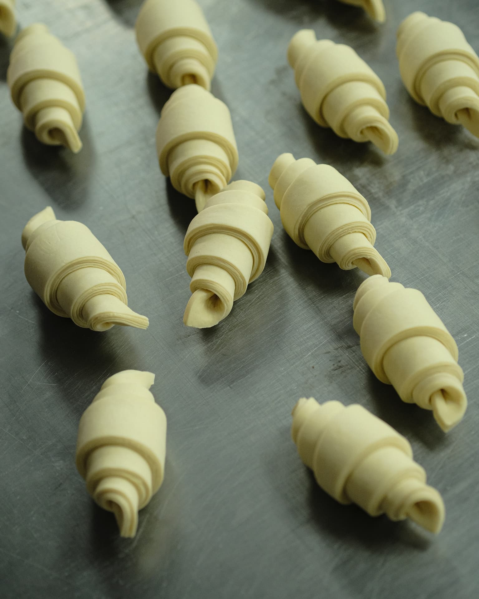Hand-rolled croissants ready for the oven at Atelier By Le GOURMAND